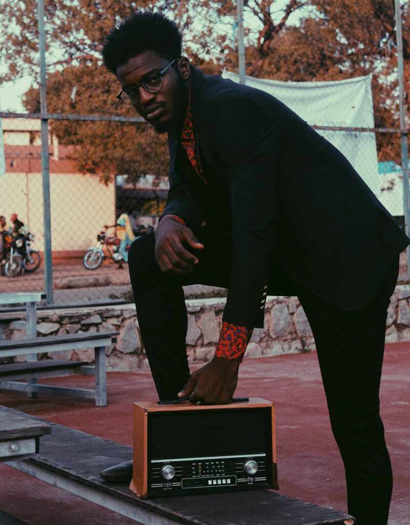 Photo Of Man Holding Radio